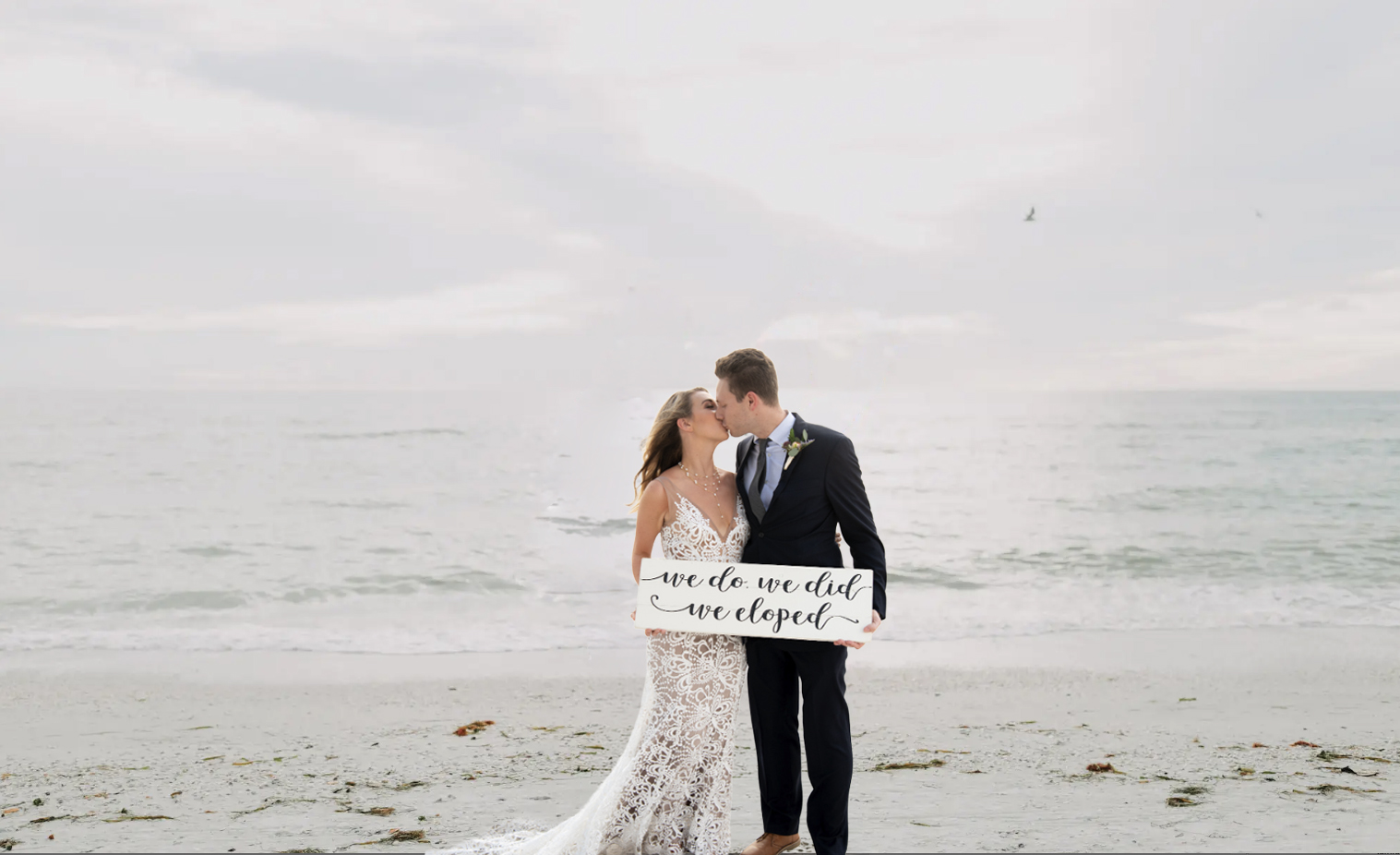 Couple kissing on the beach after eloping in the Tampa Bay area