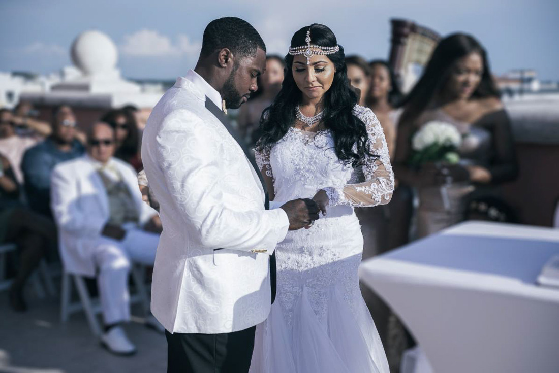 Bride standing at water's edge